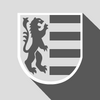 Auf dem Wappen des Stadtteils Straßdorf ist ein Betonrelief eines Löwens zu sehen.