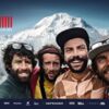 Das Werbeplakat zur Veranstaltung. 4 Männer vor einem mit Schnee bedeckten Berg.